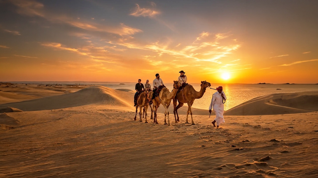 Camel ride at golden hour on a full-day desert safari in Doha, Qatar
