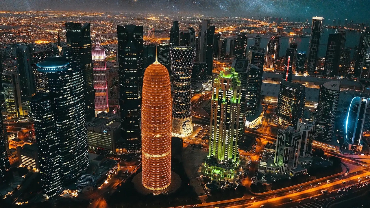 Illuminated West Bay skyline at night in Doha