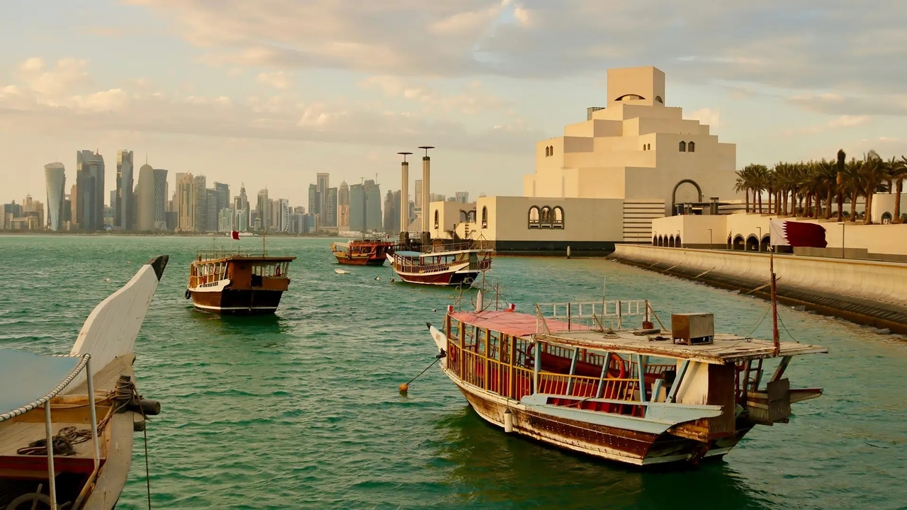 Traditional dhow boats moored near the Museum of Islamic Art in Doha