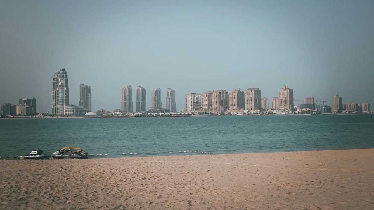 Katara beach Doha with Pearl Qatar skyline